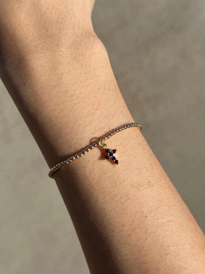 THE CROSS CHARM BRACELET – ERICA WOOLSTON | OFFICIAL SITE